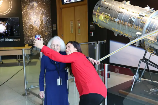Hubble social media lead Erin Kisliuk (right) takes a photo with Dr. Nancy Grace Roman (center), NASA's first Chief of Astronomy and "the Mother of Hubble," at NASA's Goddard Space. Feature updates research explained with examples