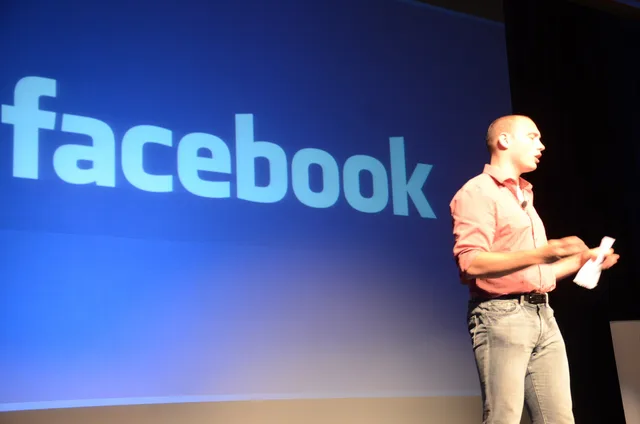 A picture of the Chief Marketing Officer and VP of Analytics for Facebook Alex Schultz that shows Facebook on smartphones having a big impact on the expansion of sports journalism and media. How FTC algorithm claims rules shape social media marketing for US firms