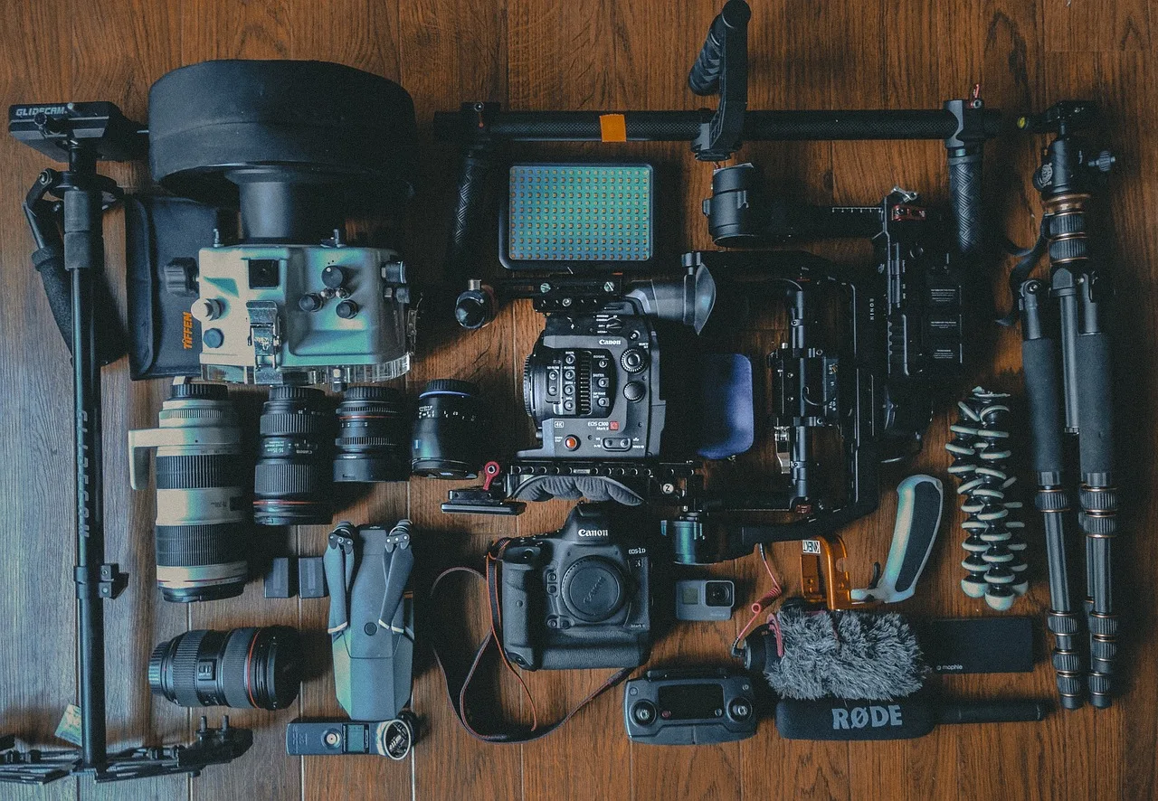 camera, gear, photoshoot, photo, video, lens, light, tripod, glider, wood, table, flash, go pro, tripod, go pro, go pro, go pro, go pro, go pro. Los Angeles Miami Creator Algorithm Adaptation Strategies