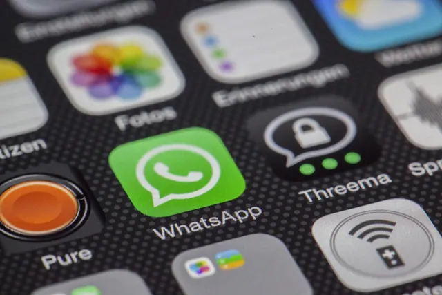Detailed macro of smartphone screen showcasing popular app icons like WhatsApp. Recommendation systems platforms explained with examples